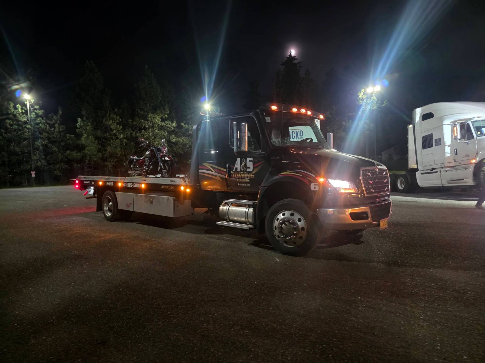 Motorcycle tow on flatbed