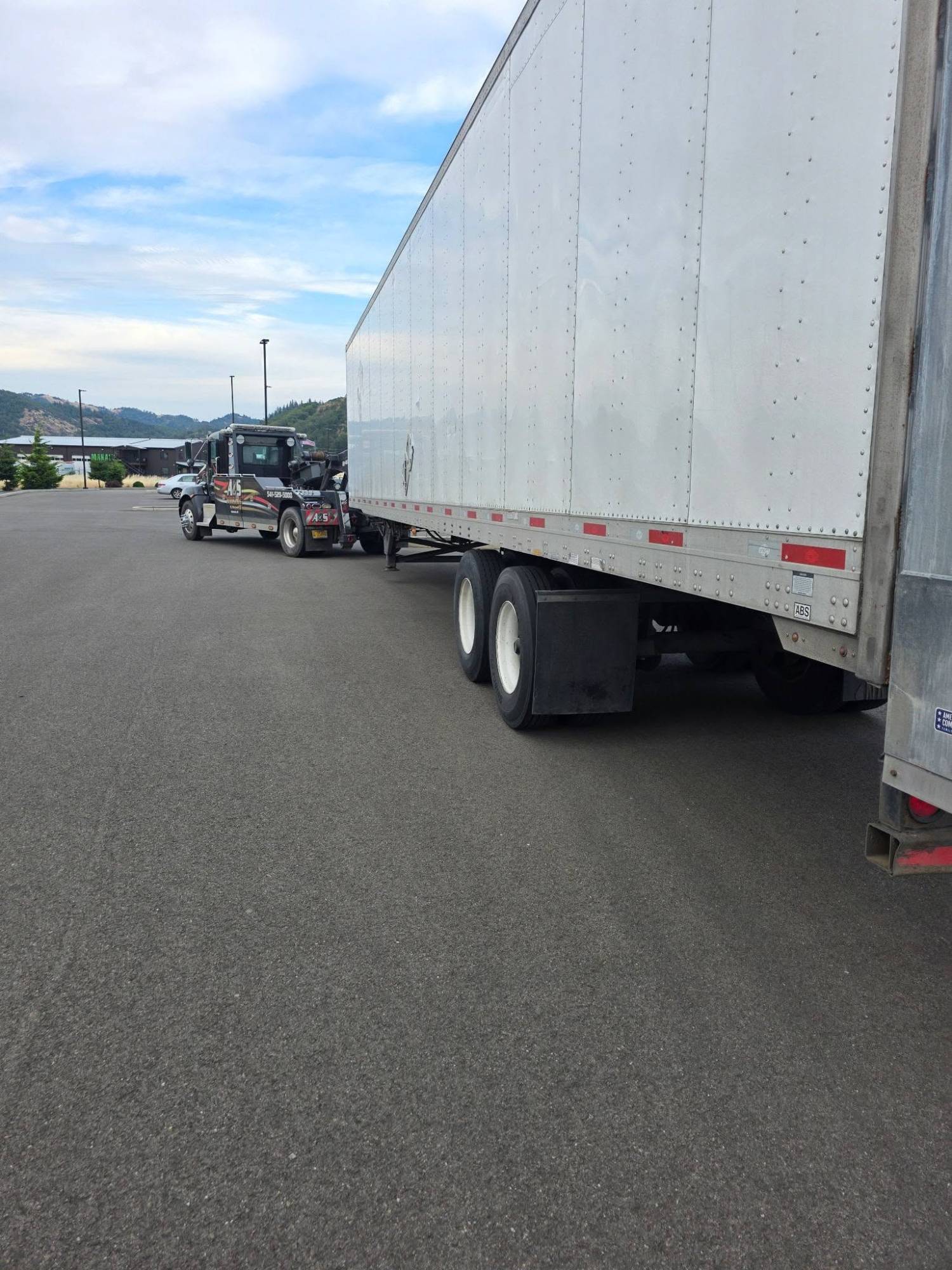 Semi truck towing on I-5
