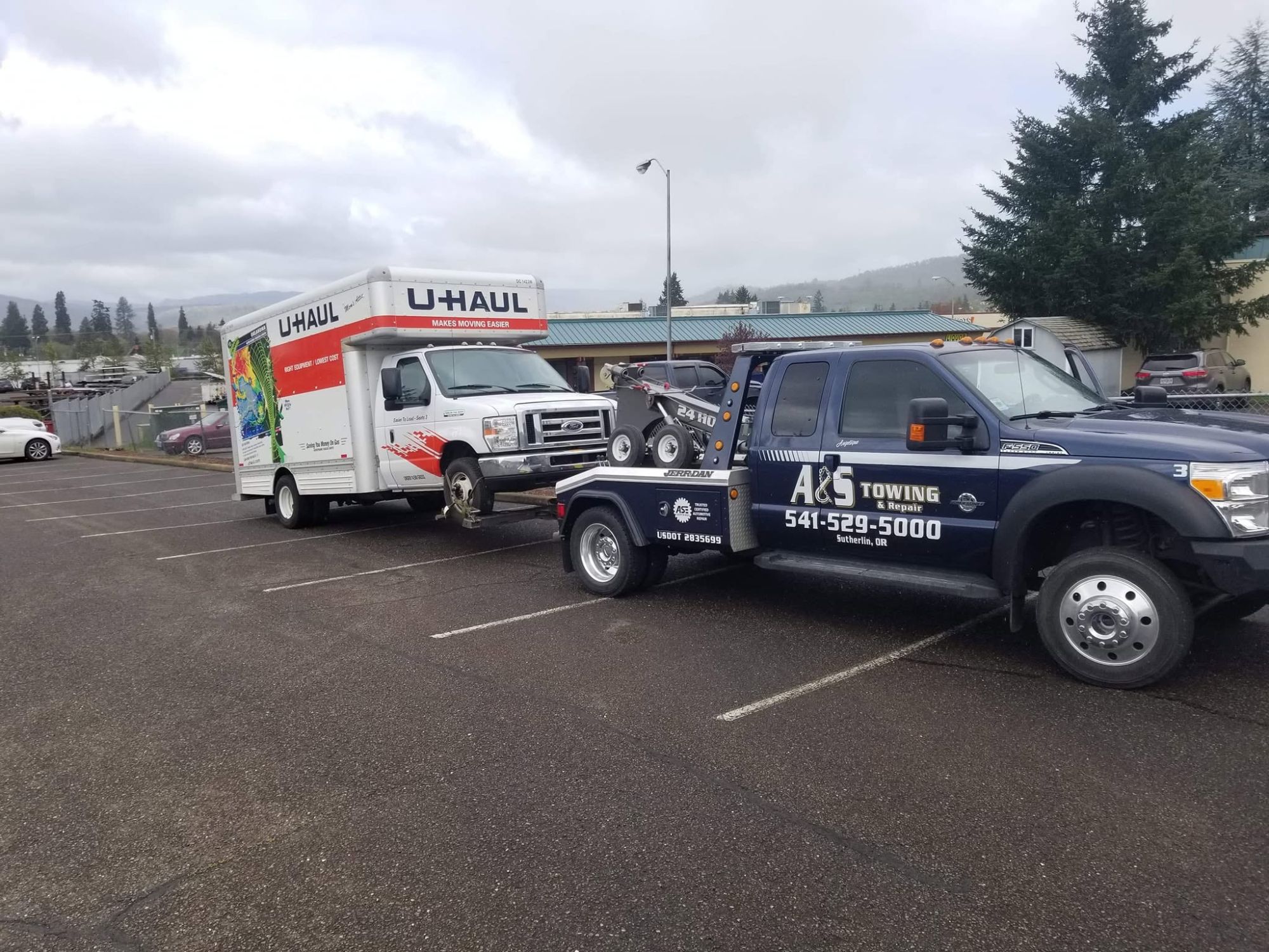 A&S light-duty towing a U-Haul truck